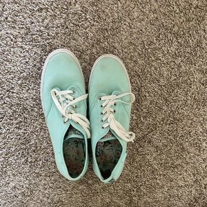 Teal vans with floral details